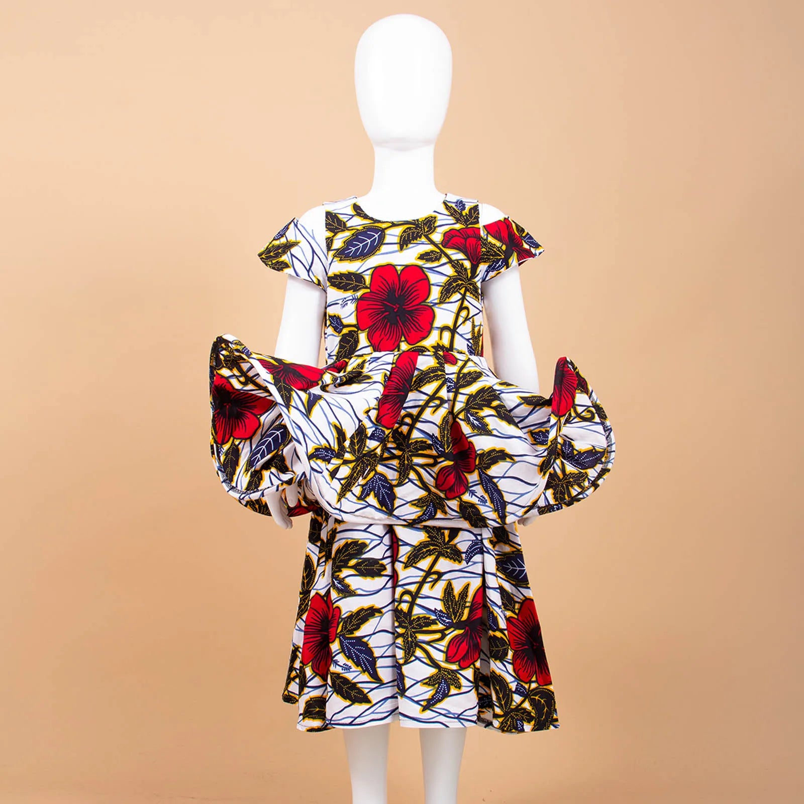 Mannequin wearing a colorful floral dress on a beige background